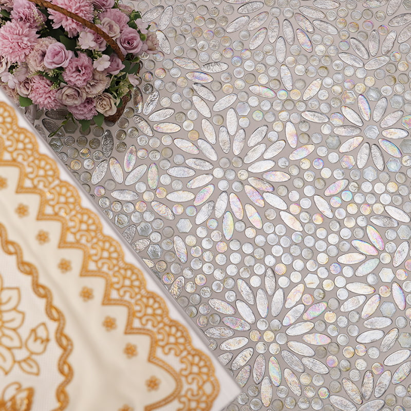 Close-up view of iridescent petal-shaped mosaic tiles with a soft shine