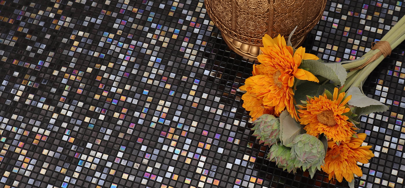  Iridescent tiles combined with decorative elements like flowers, creating a vibrant pattern.