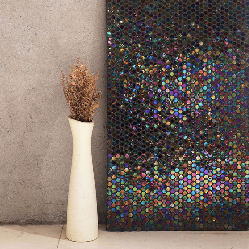 Iridescent hexagonal tiles creating a stunning, colorful effect on the wall 
