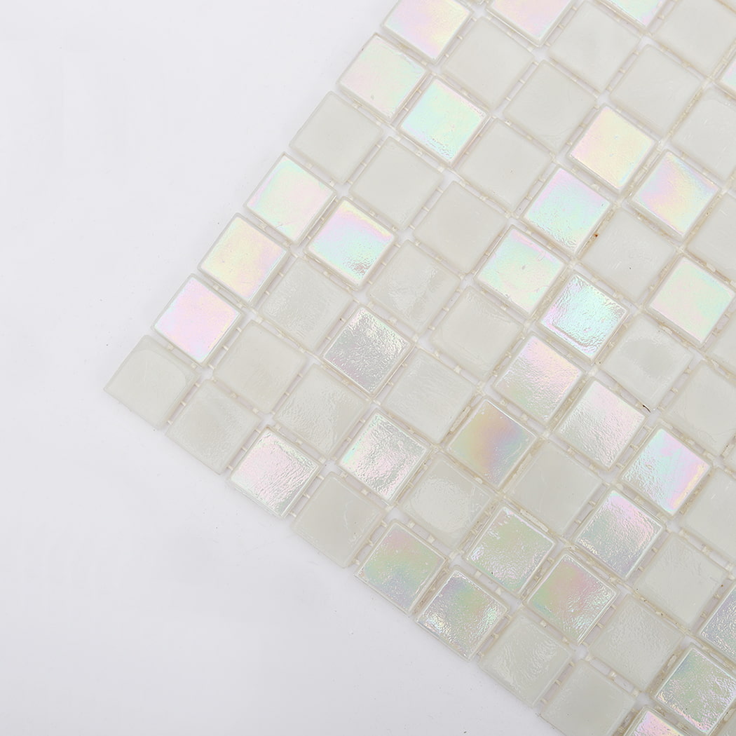 close up of iridescent white glass mosaic tile corner showing rainbow reflection