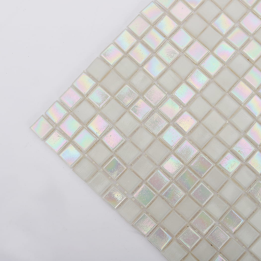 Diagonal corner detail of iridescent white small square glass mosaic tiles