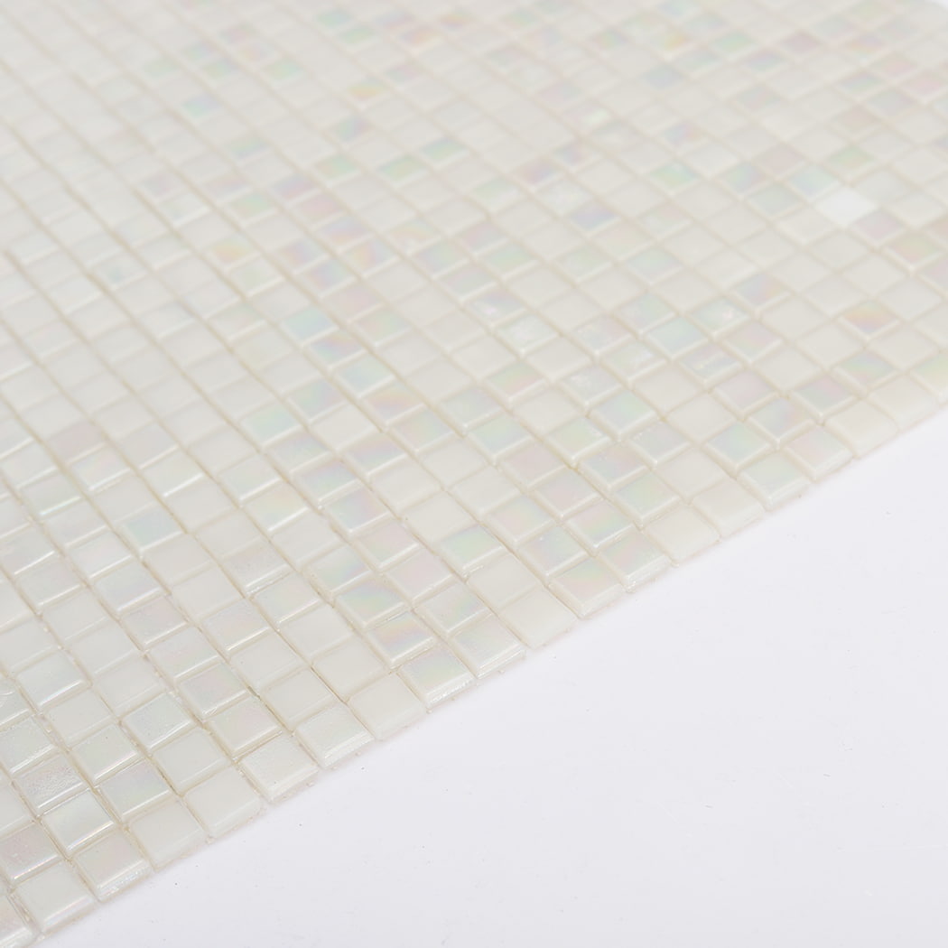 Layered edge view of iridescent white small square glass mosaic tile sheet
