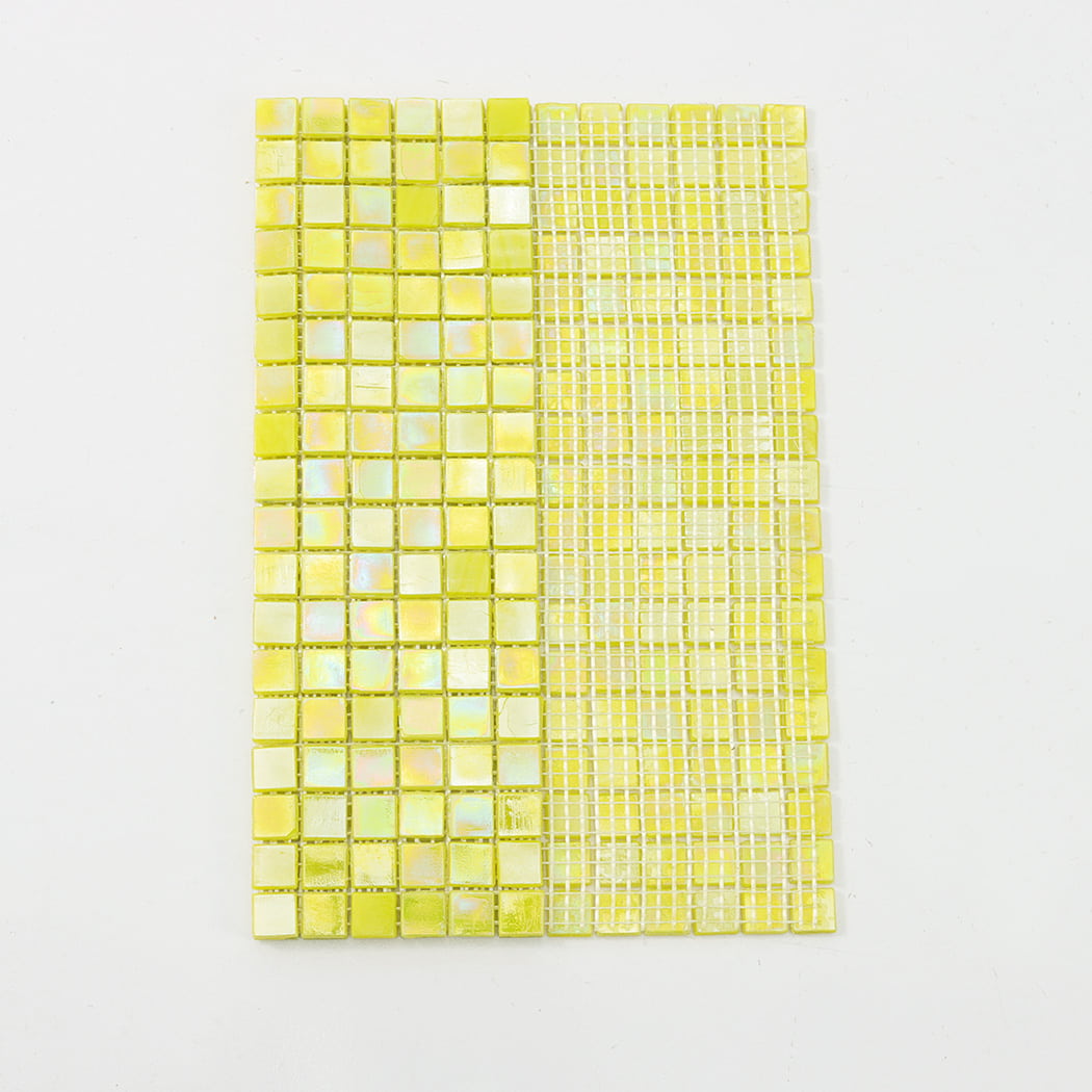 Rear view of a yellow mosaic tile sheet showing the white mesh backing for installation.