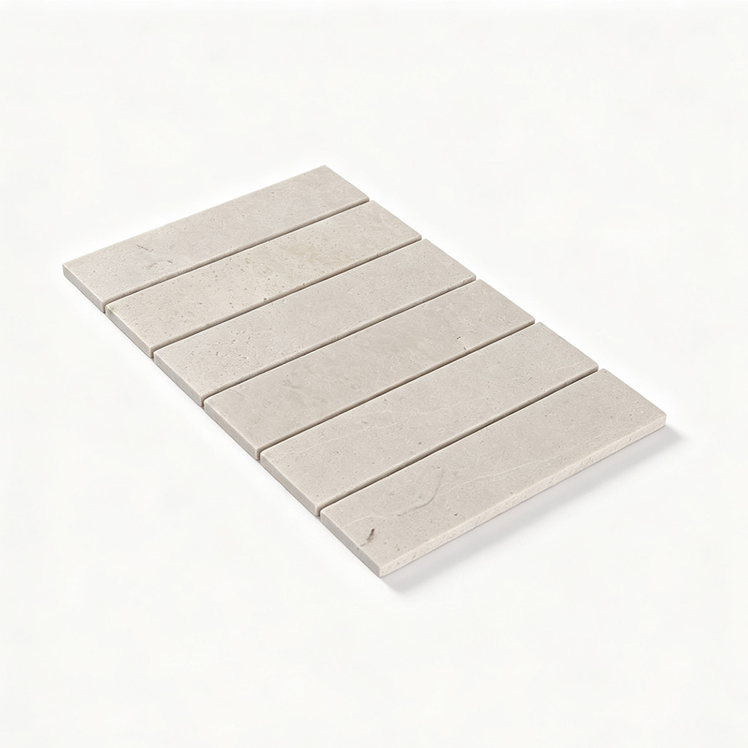 Angled view of an ivory linear travertine mosaic sheet with natural pores
