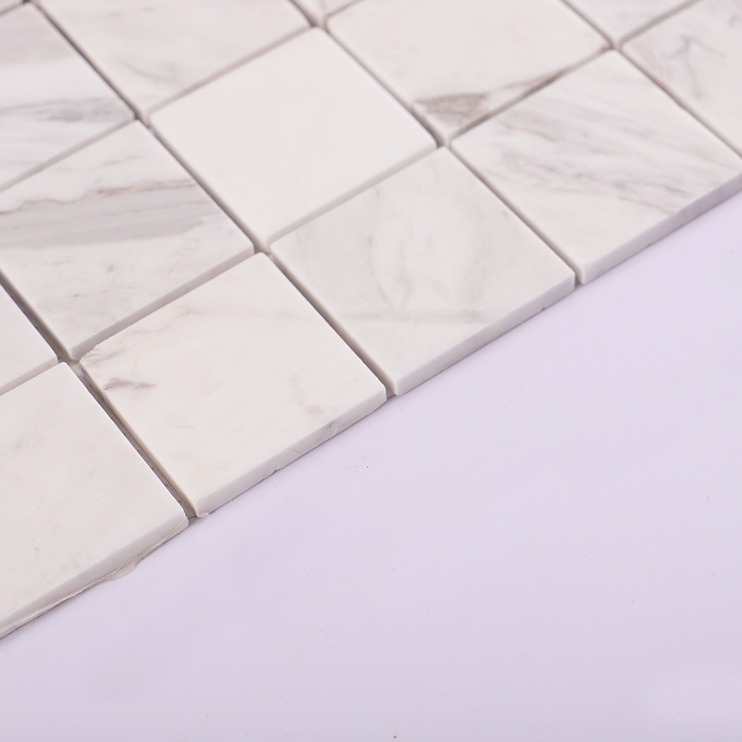 Side view of Jazz White natural marble mosaic tile showing tile thickness.