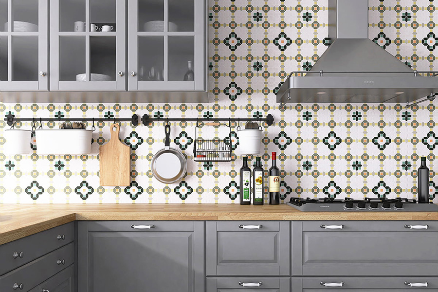Stylish kitchen wall tiles with gray cabinets and decorative patterned backsplash