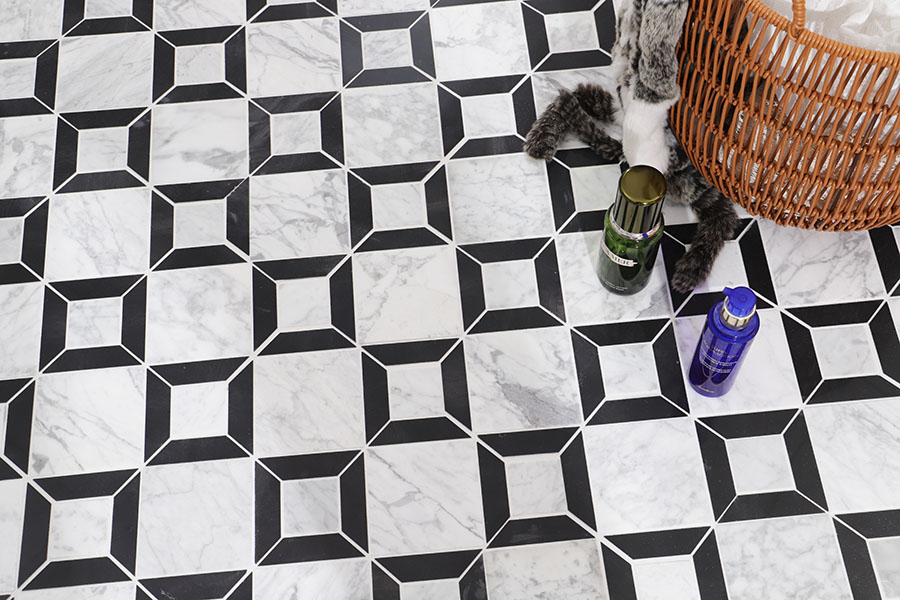 Large black and white marble mosaic floor tile with bold geometric square design