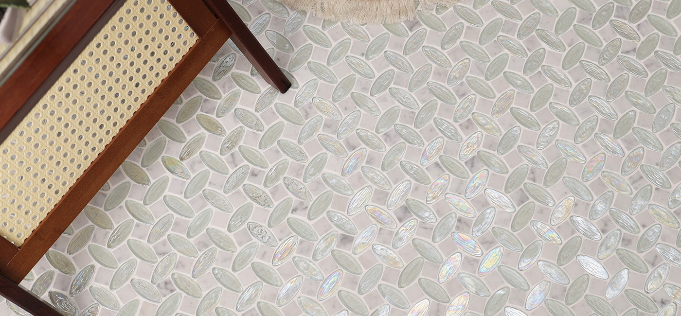Wide view of leaf shape glass and marble mosaic tile flooring