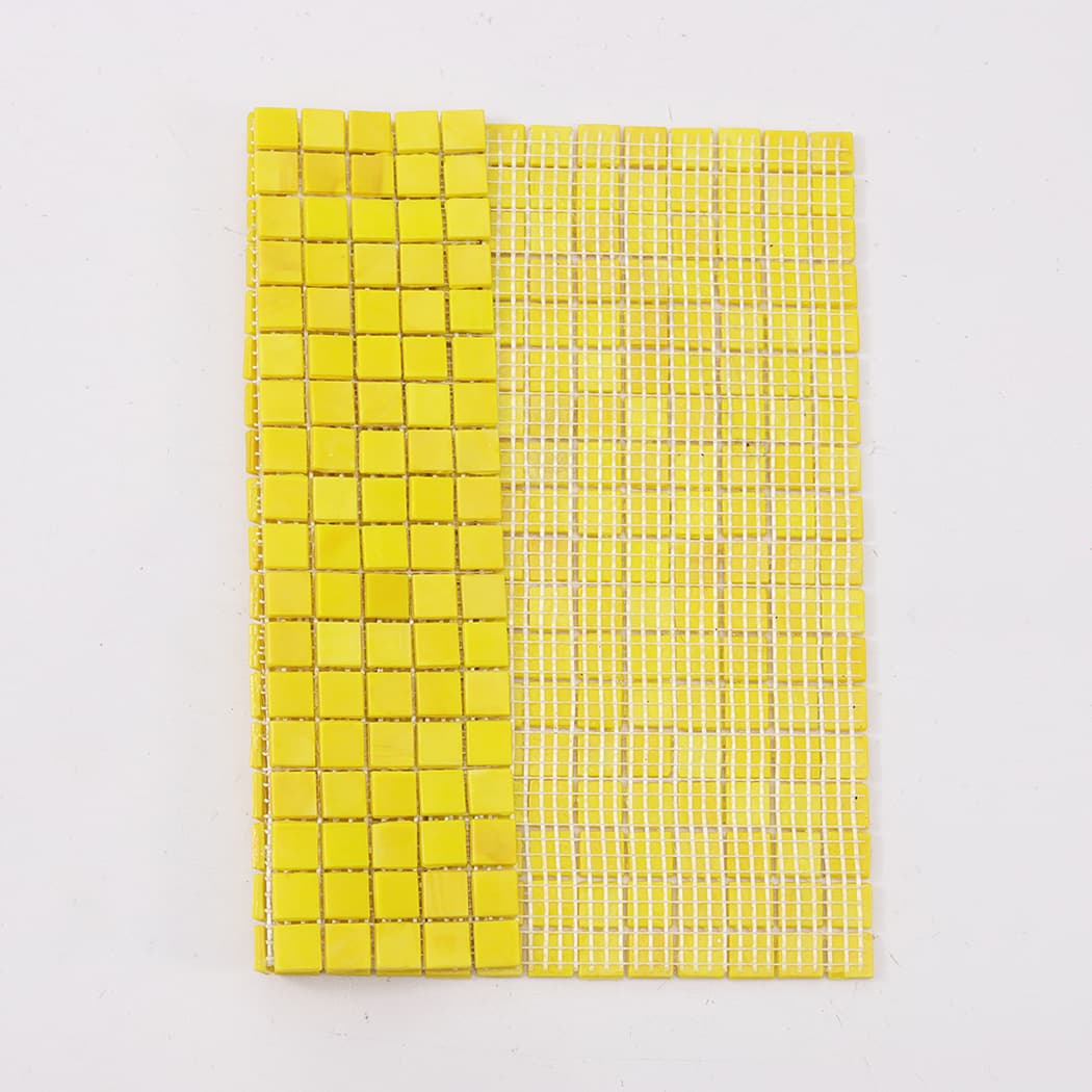 Rear mesh backing view of lemon yellow square glass mosaic tile