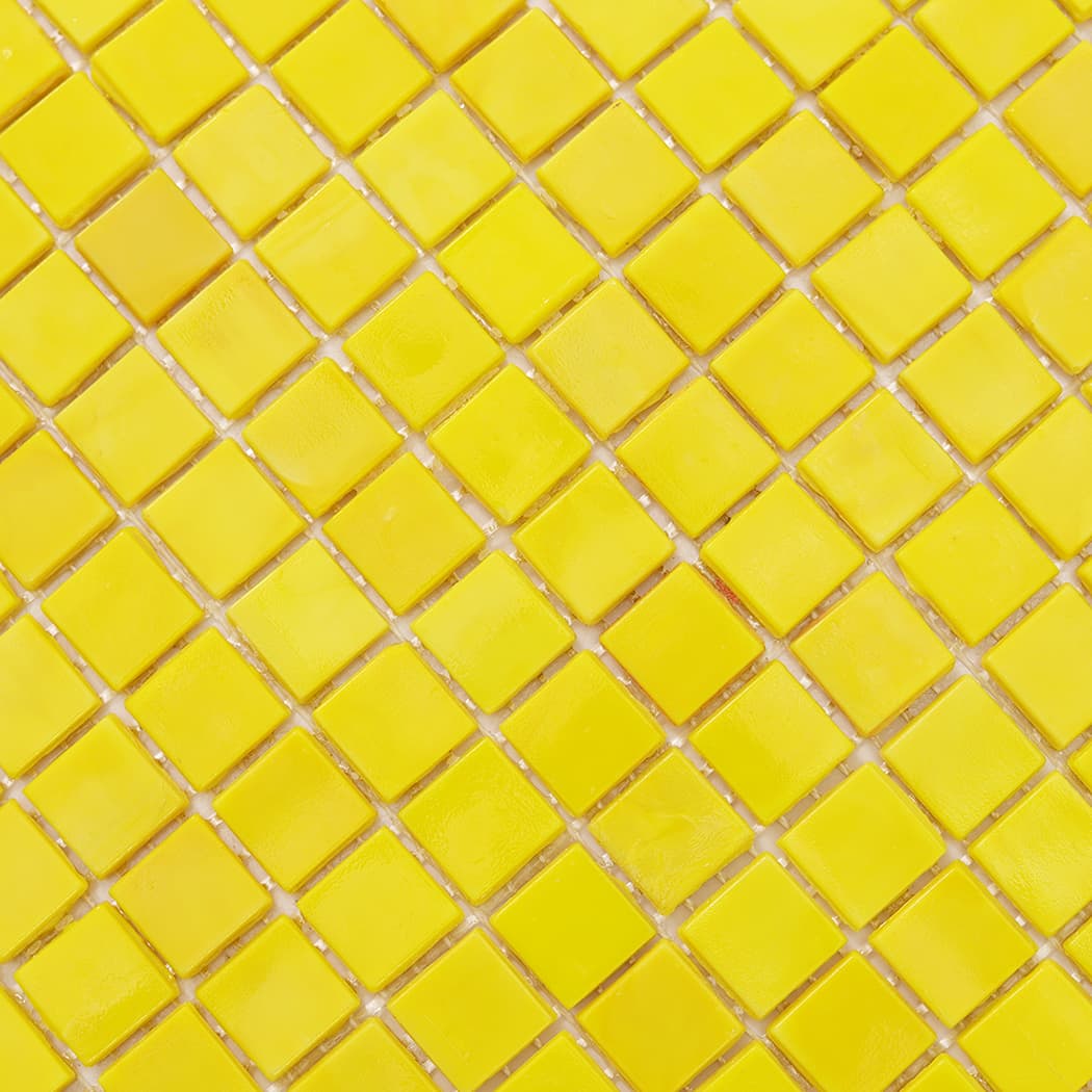 Surface pattern close-up of lemon yellow square glass mosaic tile