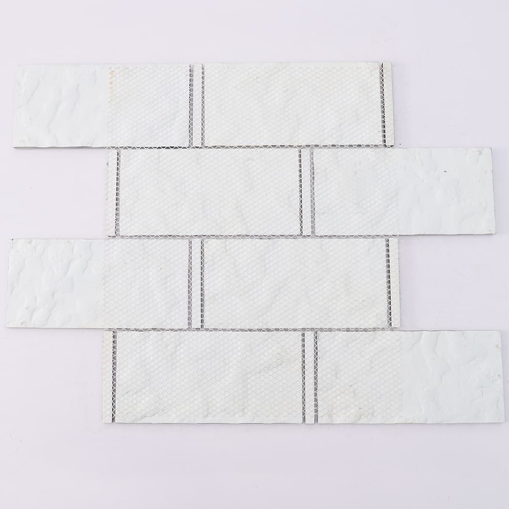 Mesh backing of light blue glass subway mosaic tile sheet with glass accents