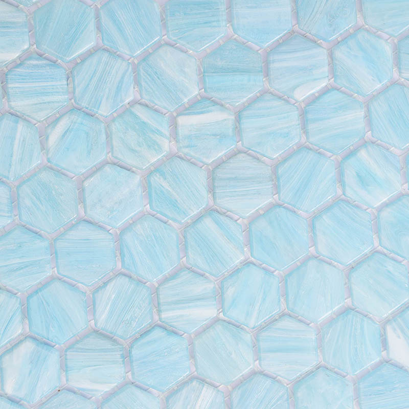 Light blue hexagon mosaic tile pattern with soft variation and white grout, close-up