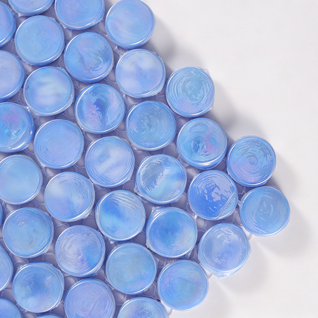 Close-up corner view of light blue iridescent round glass mosaic tiles