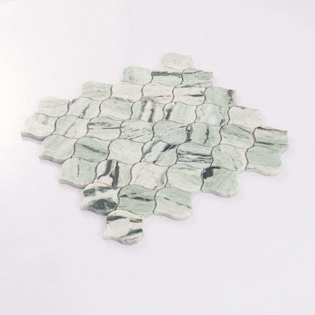 Angled view of light green arabesque marble mosaic tile on white background