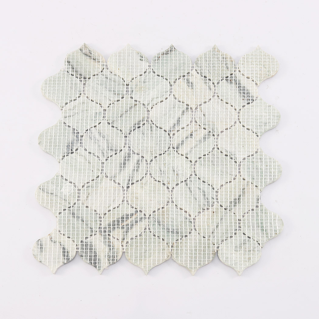 Back view of light green arabesque marble mosaic tile showing mesh backing