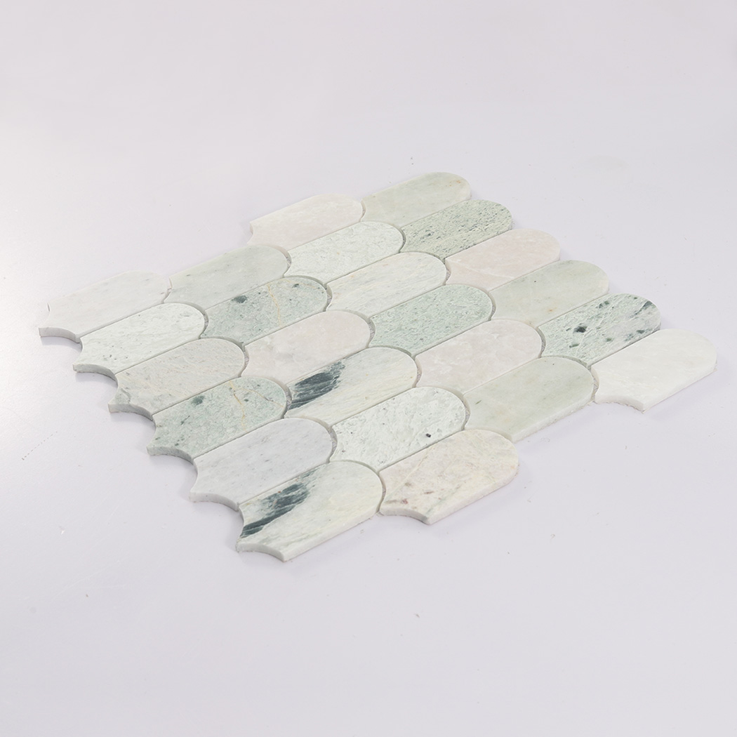 Angled view of light green arched marble mosaic tile sheet