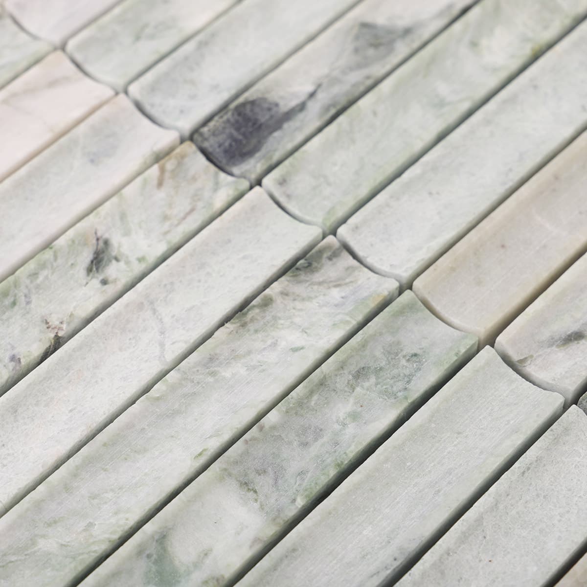 Surface texture of light green fluted marble stick tiles