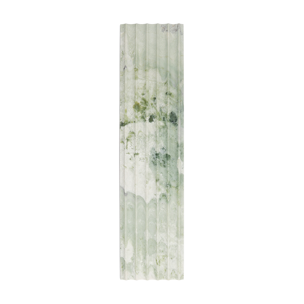 Front view of light green marble fluted tile with soft natural veining