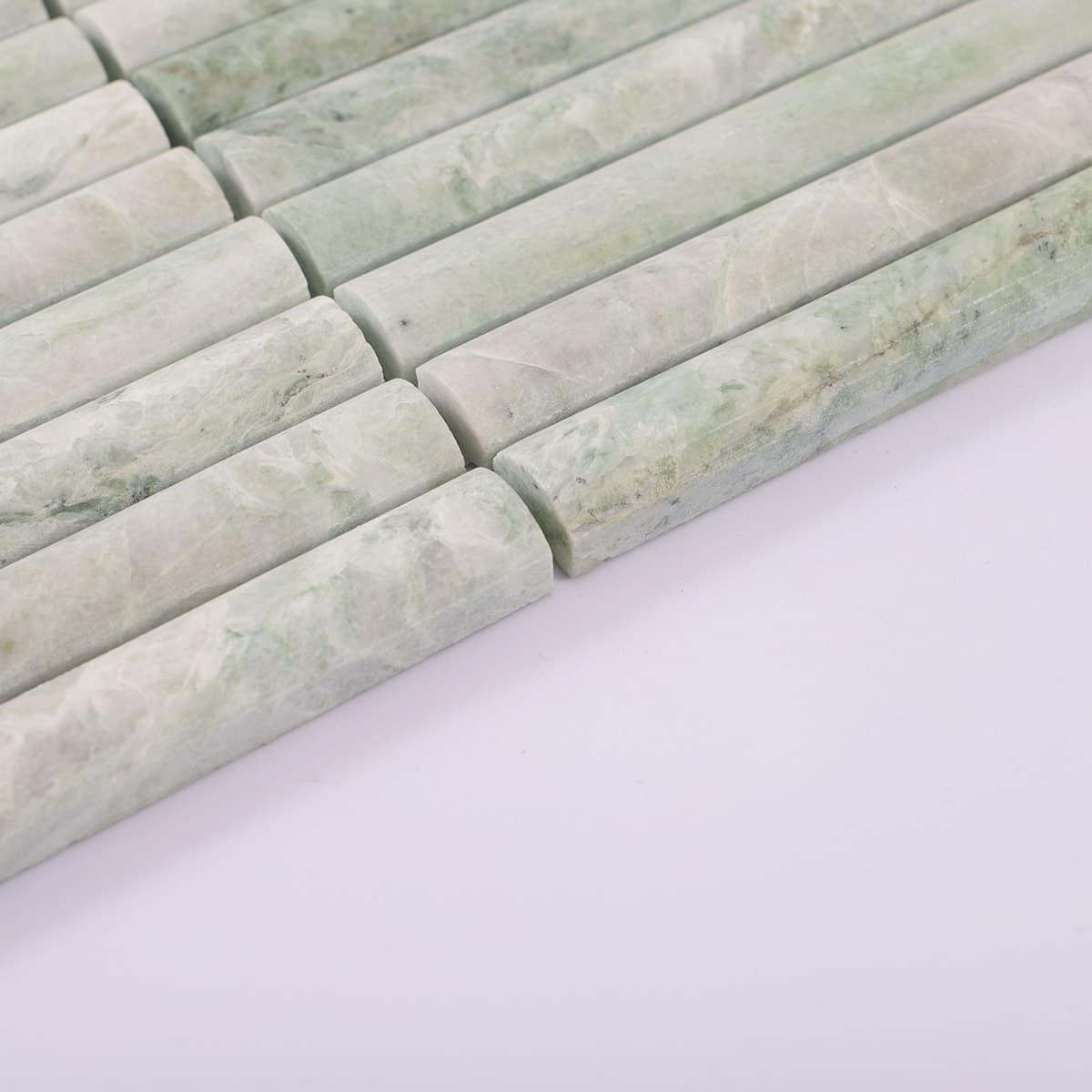 Side perspective of fluted jade green marble tile strip