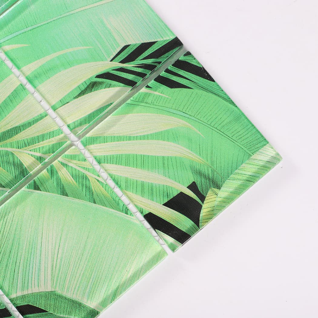 Corner detail of light green tropical leaf square glass mosaic tiles