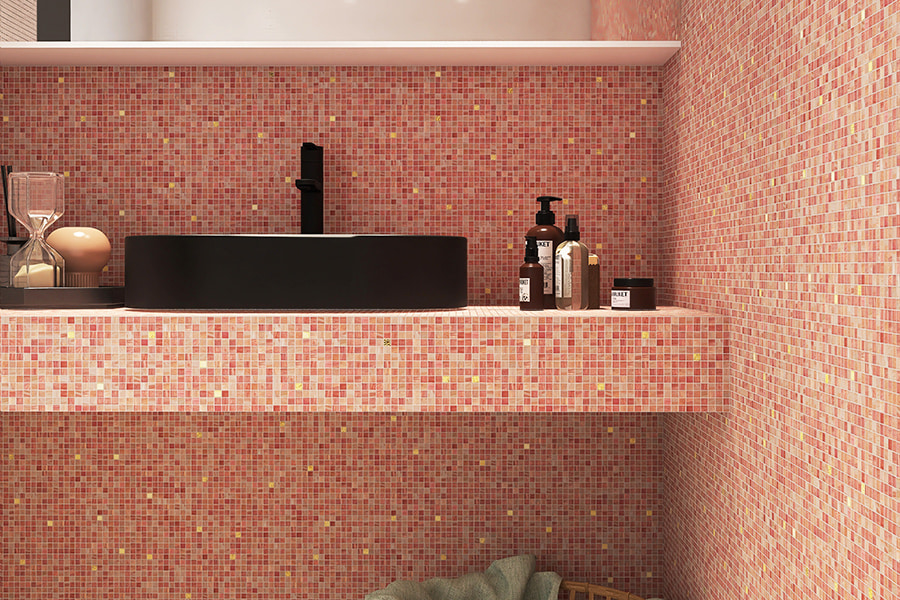  Close-up of light pink glass mosaic tile wall showcasing matte and iridescent surfaces 