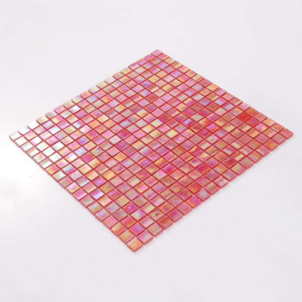 Angled view of a full light red iridescent square glass mosaic tile sheet