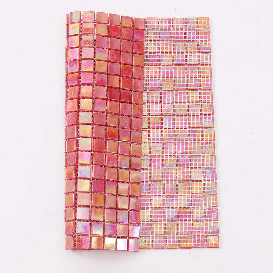 Light red iridescent square glass mosaic tile sheet showing front and mesh backing