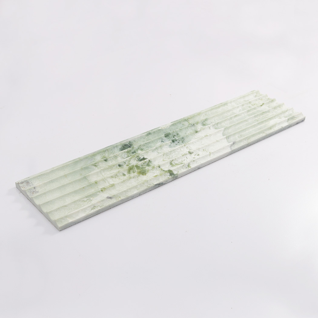 Long light green marble fluted tile displayed on a clean white background