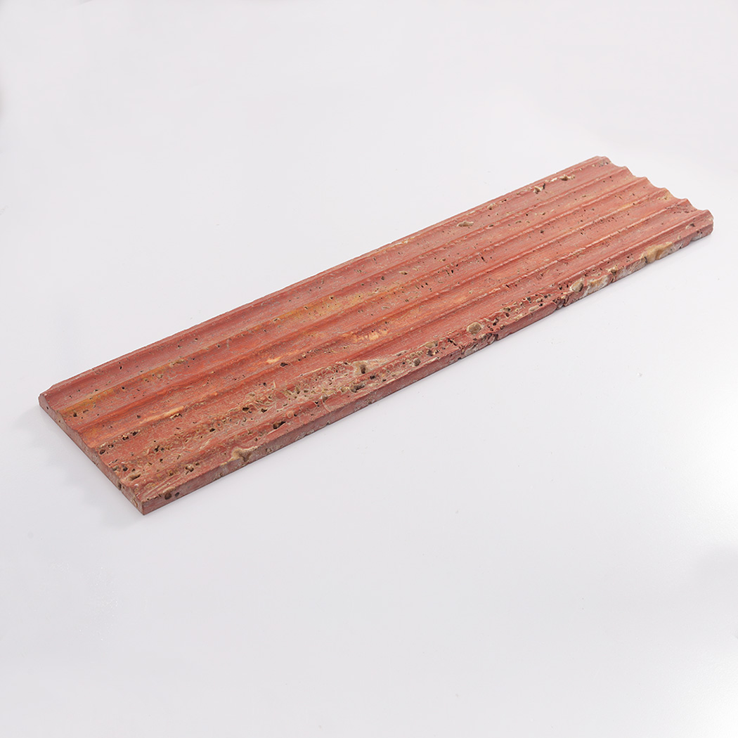 Long red travertine fluted tile displayed on a clean white background