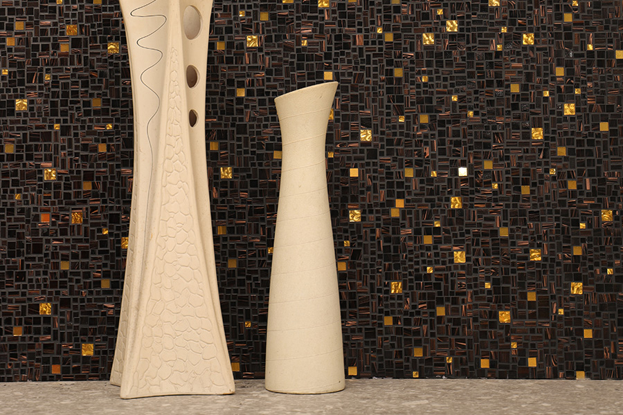 Luxury black and gold mosaic wall tiles used as a stylish interior backsplash.