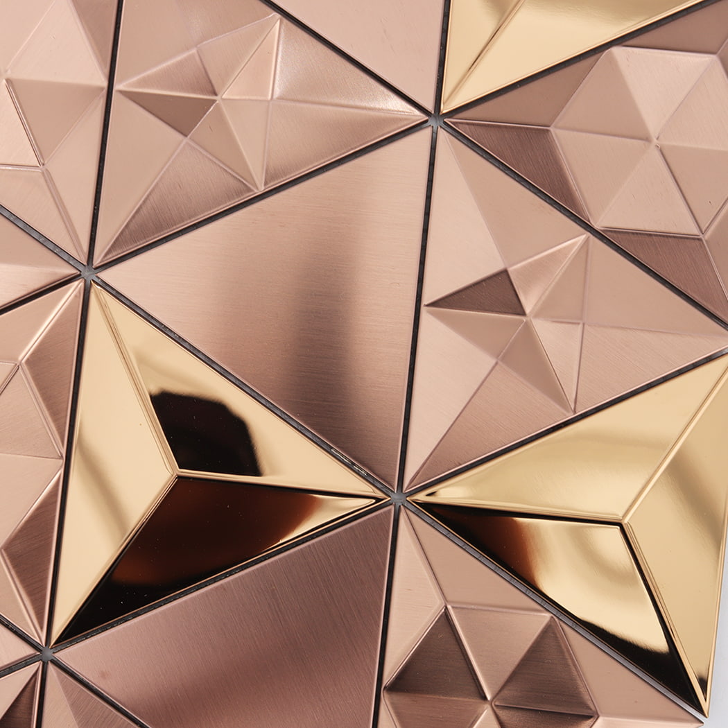 Macro shot highlighting the different angles and light reflections on rose gold tiles.