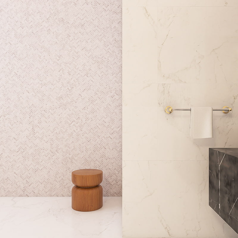 Light beige marble herringbone mosaic wall adjacent to large marble slab tiles 