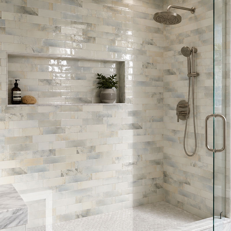 Marble look glass subway tile shower with built in niche
