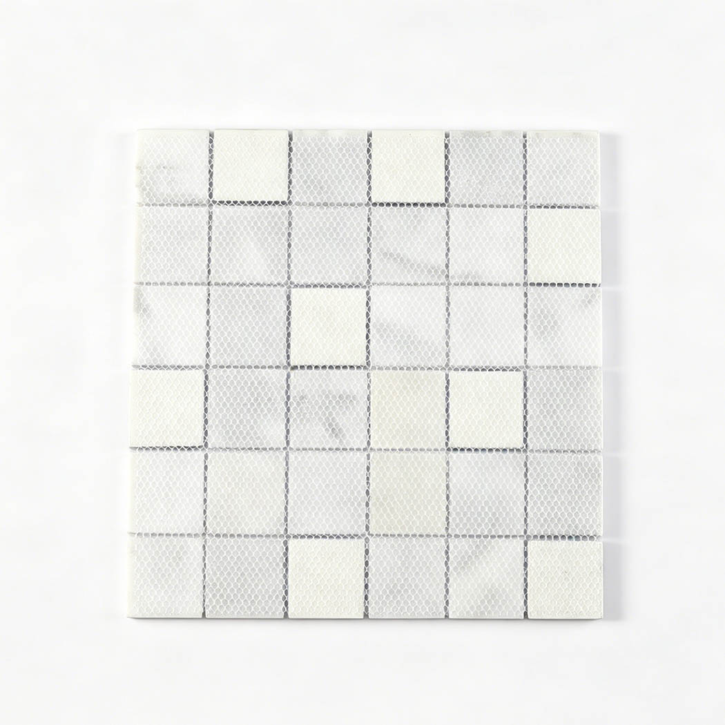 Mesh mounted back of white marble and blue glass square mosaic tile sheet