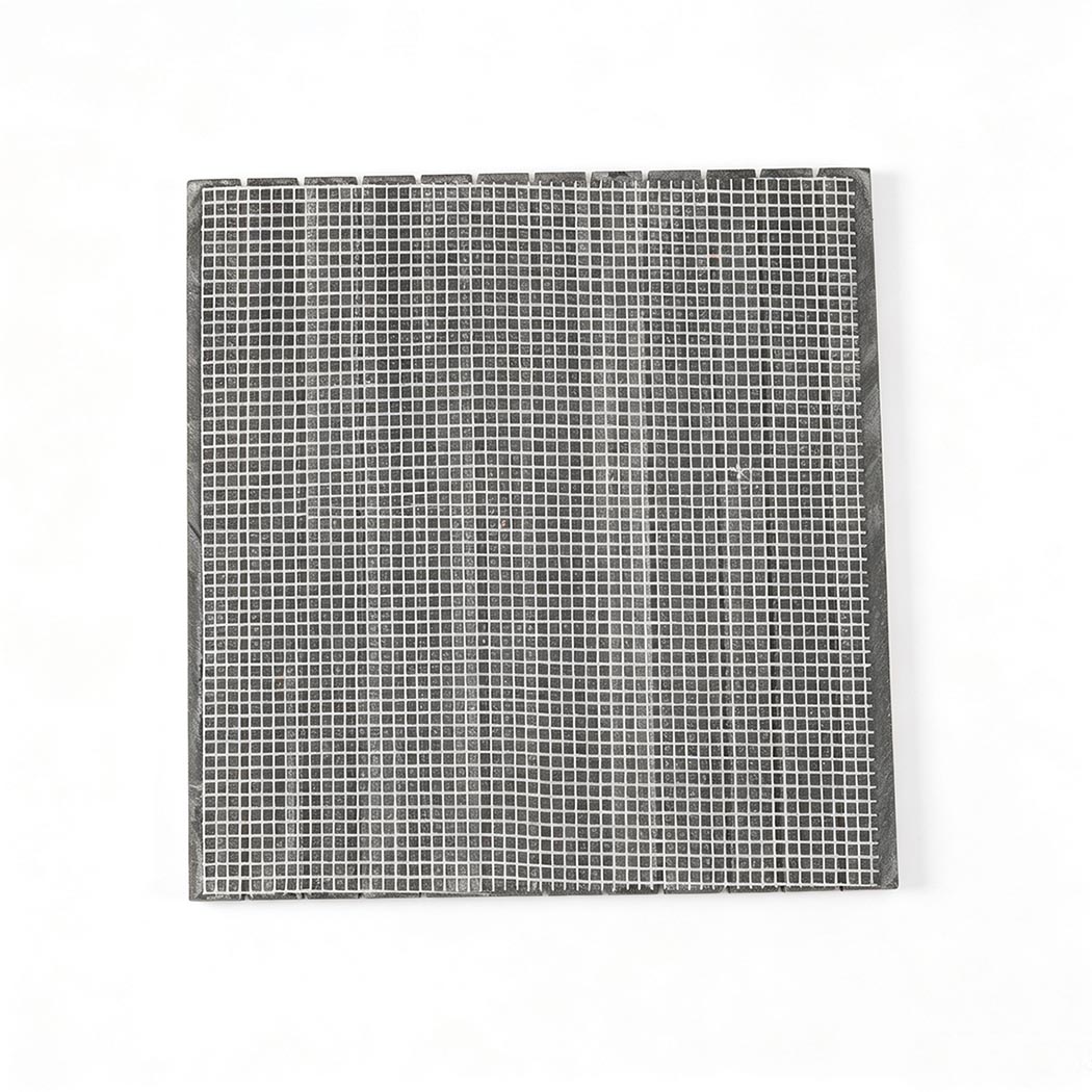 Back view of a black marble mosaic sheet with flexible mesh backing
