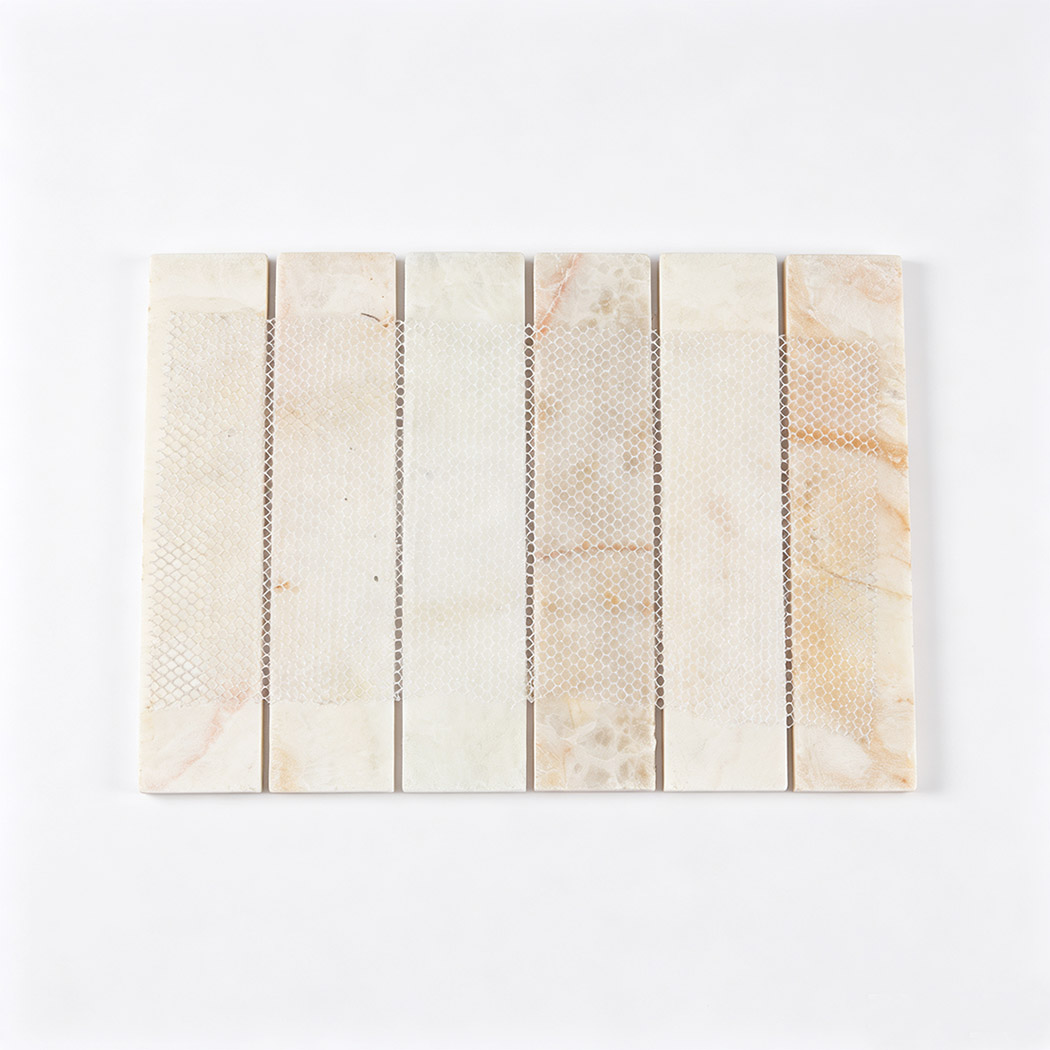 Back view of a cream marble strip mosaic tile with flexible mesh backing