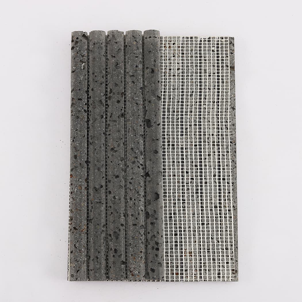 Rear view of the lava stone mosaic showing the white mesh mounting for installation.