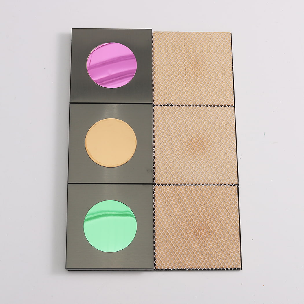 Three tiles showing the decorative front and three showing the adhesive mesh backing.