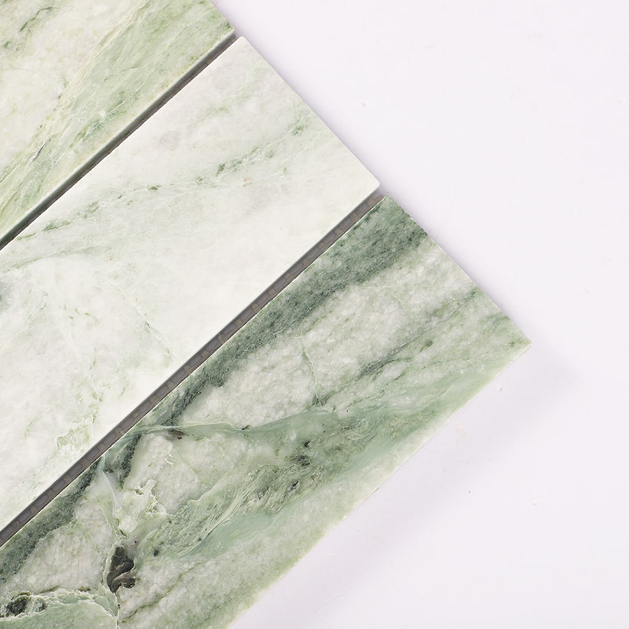 Close up of Ming green vertical natural marble mosaic tile showing texture.