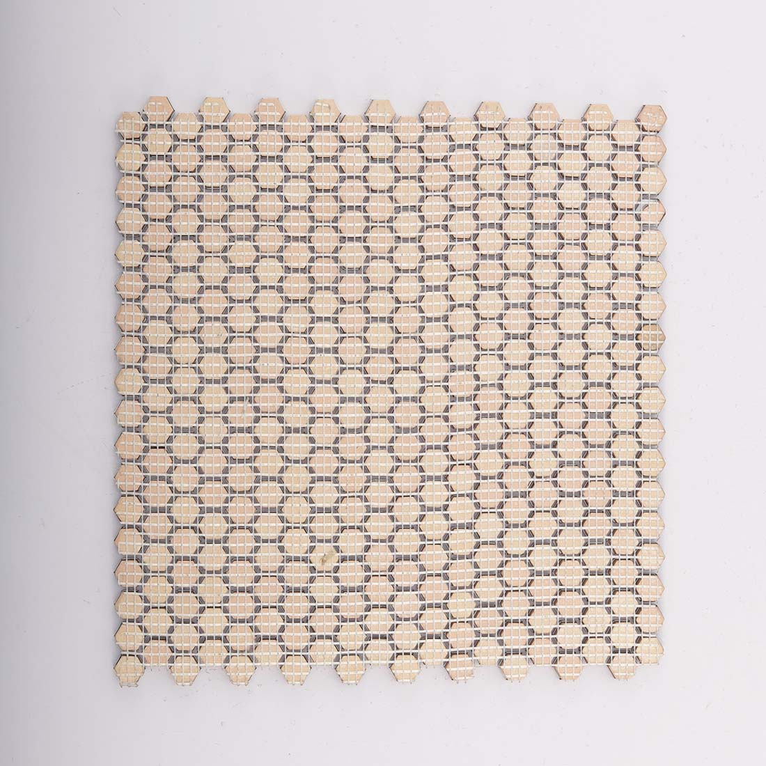 Reverse fiberglass mesh backing structure of antiqued copper hexagon tile
