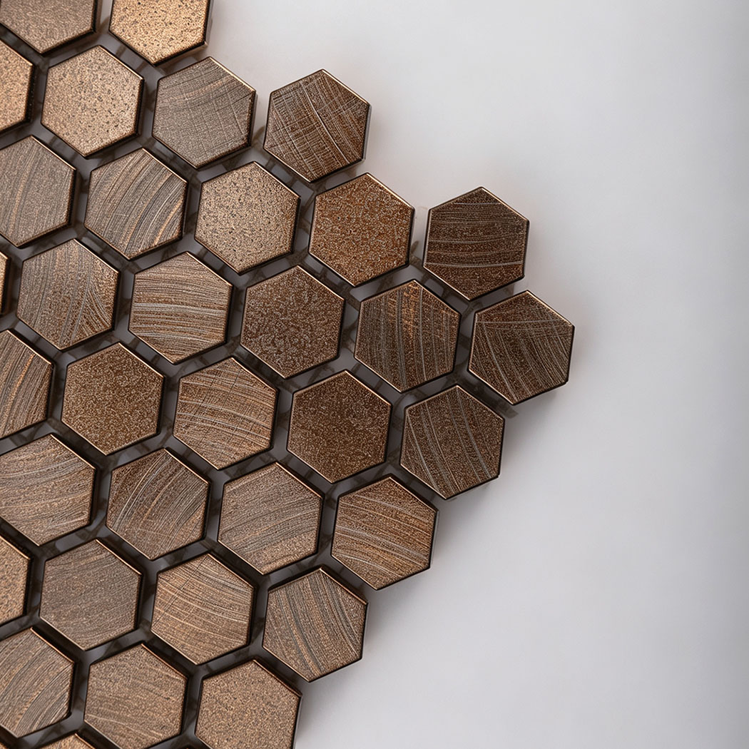 Corner closeup showing metallic texture of antiqued copper hexagon tile