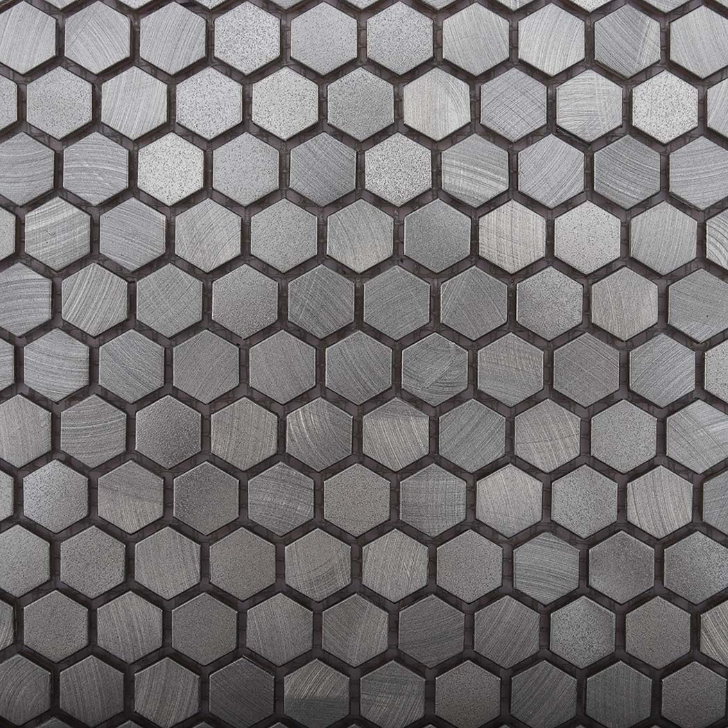 Surface finish close up of brushed silver aluminum hexagon chips