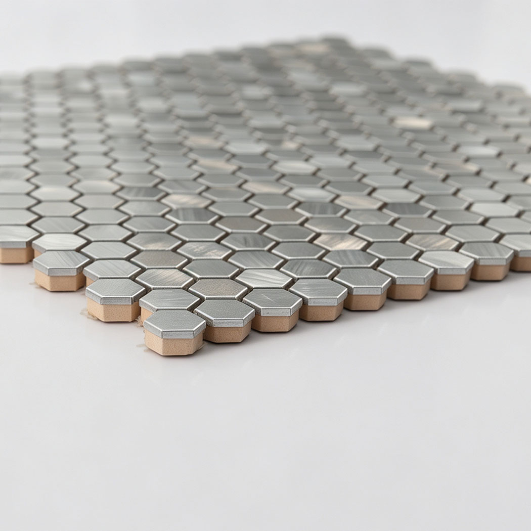 Low angle profile view showing thickness of mini silver hexagon tile