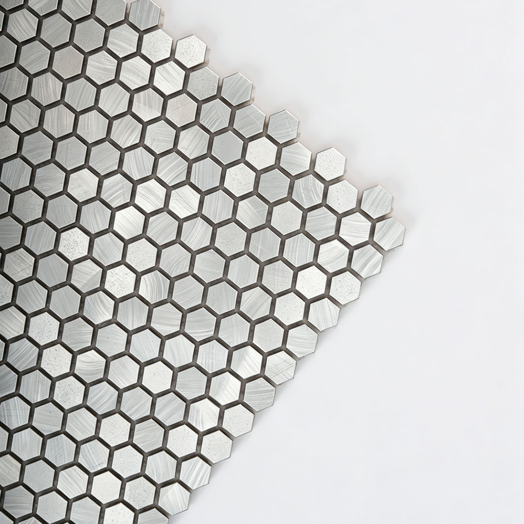 Corner closeup showing brushed metal texture of mini hexagon tile