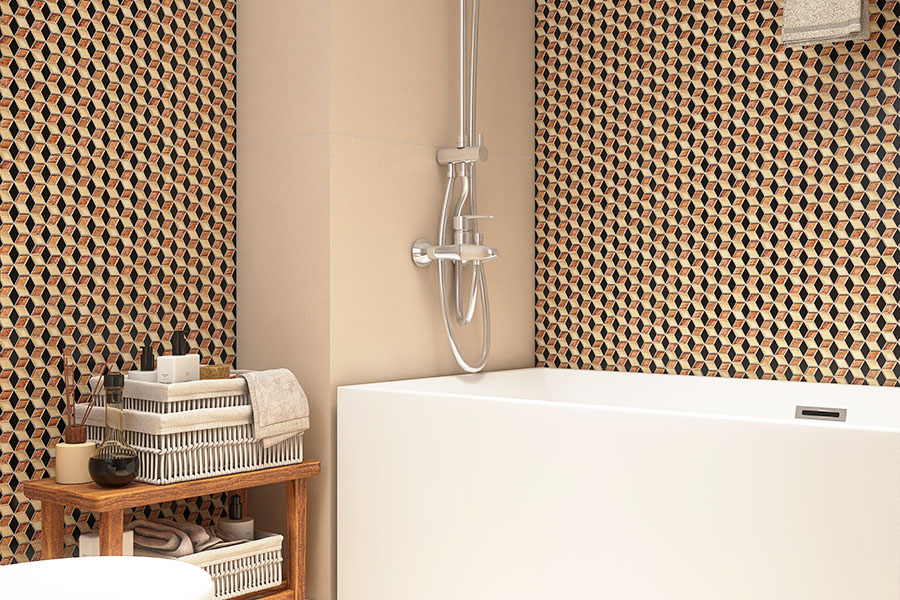Modern bathtub area with beige and black geometric mosaic wall tiles