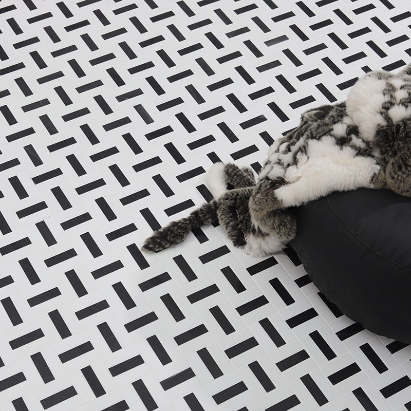 Modern rectangular black and white marble basketweave floor tile.