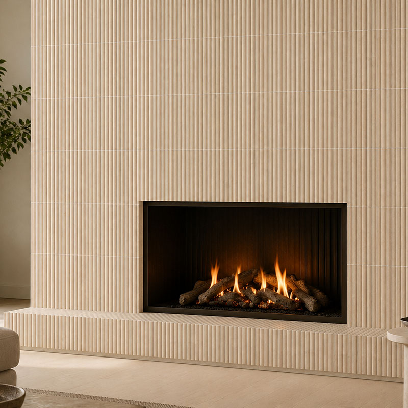 Close-up of a modern fireplace clad in vertical fluted beige travertine tiles