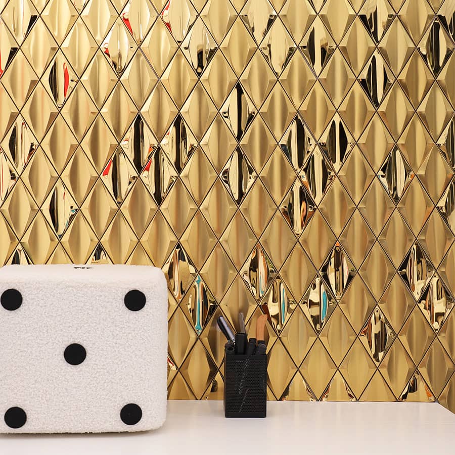 Modern interior wall covered with gold stainless steel diamond mosaic tiles