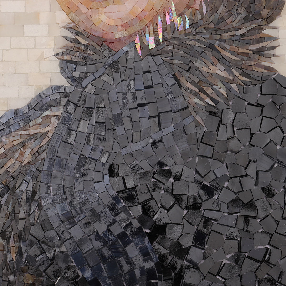 Detailed mosaic of black glass tiles simulating fur texture
