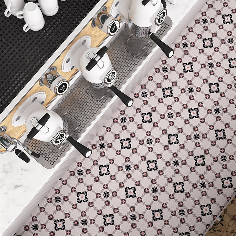Coffee bar with floral mosaic tile floor in black, white and pink tones